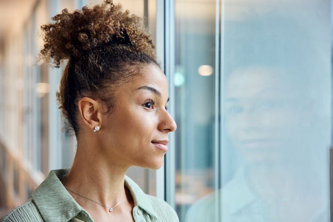 Woman looking out of window